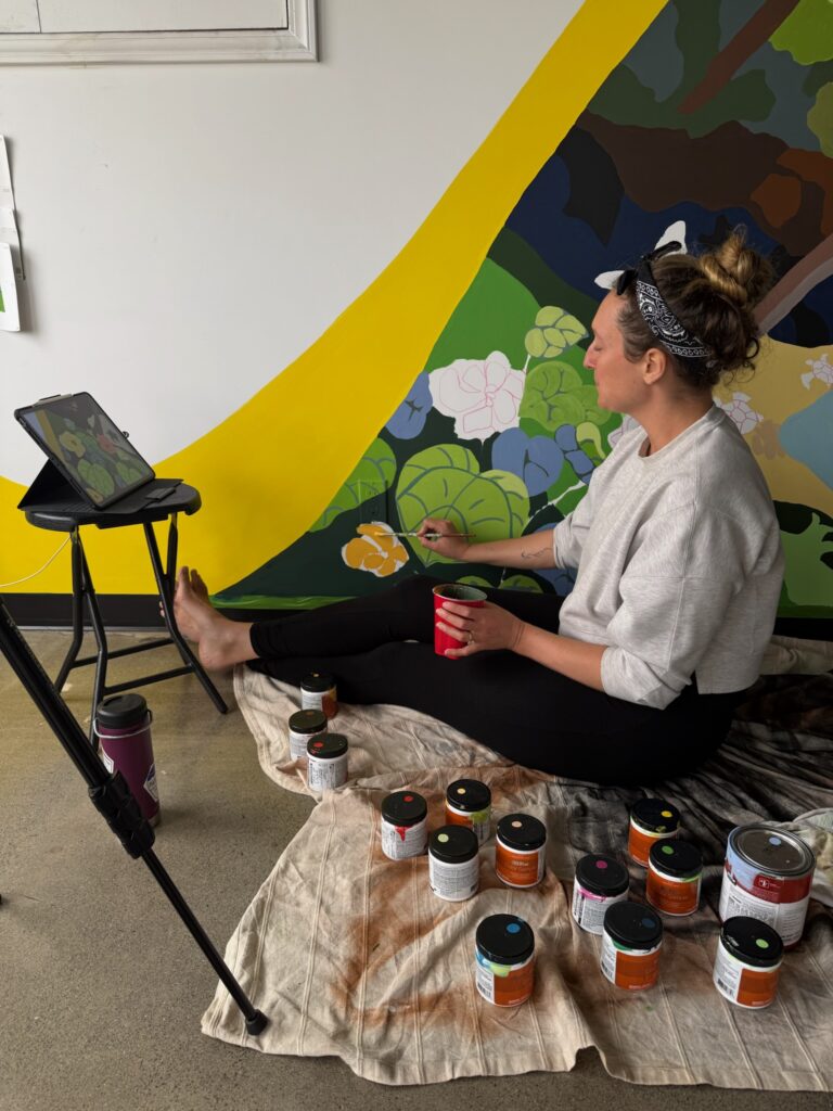 Maui Mural artist works on north shore maui beach scene.